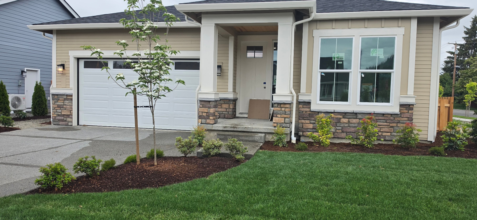 Craftsman home with stone veneer column accents