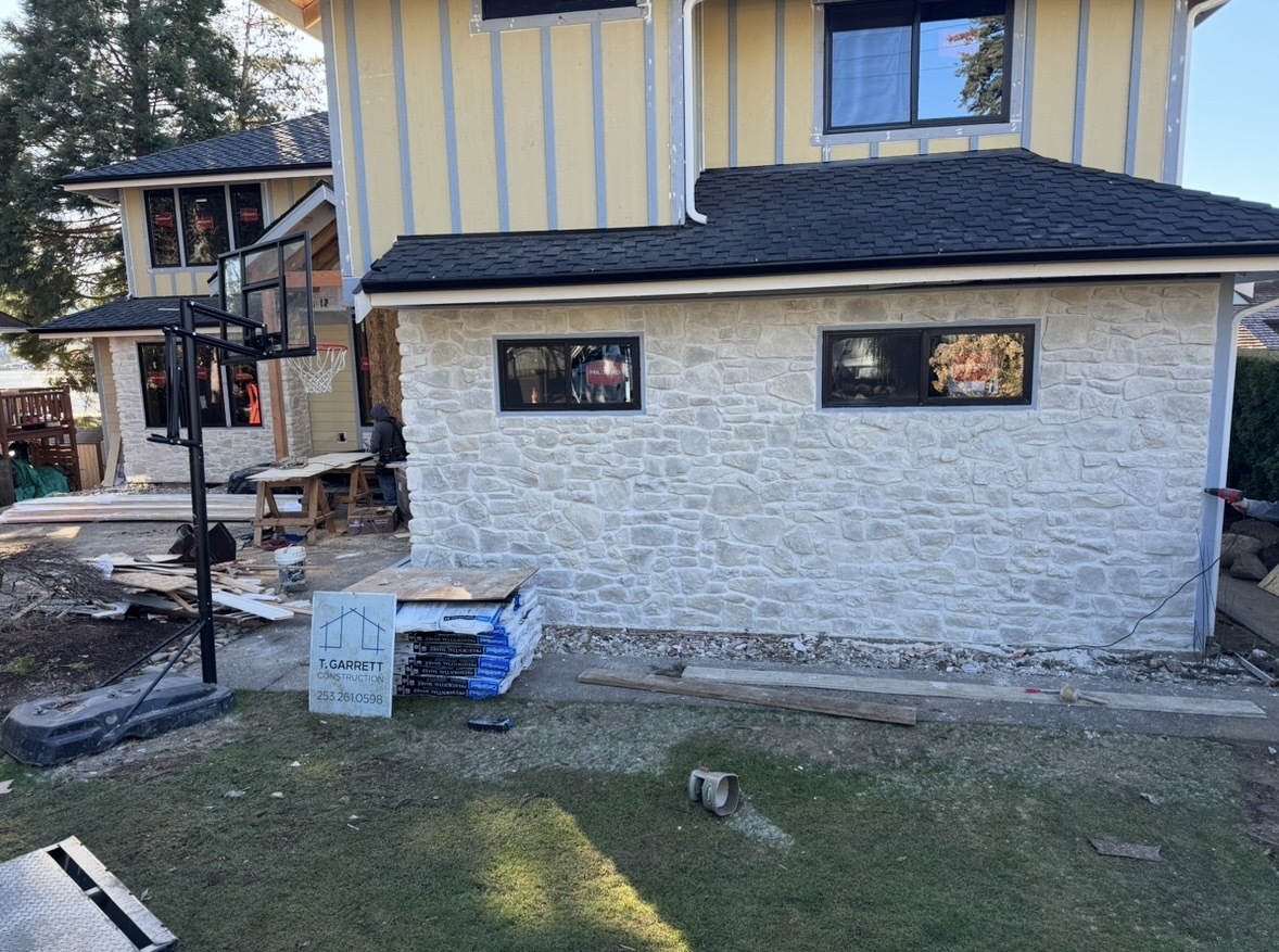Hand-laid white stone veneer exterior wall